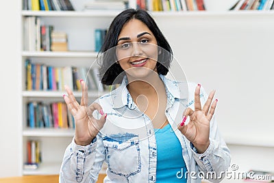 Happy hispanic mature adult woman at home Stock Photo