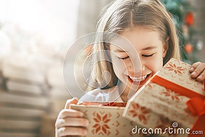 Child opening gift Stock Photo