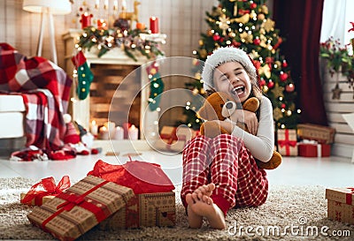 Child opening Christmas present Stock Photo