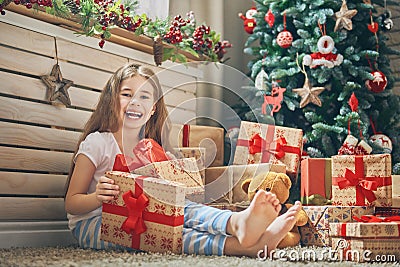 Child opening present Stock Photo