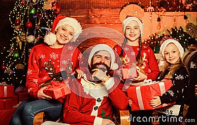 Happy holidays. Father bearded man and mother with cute daughters christmas tree background. Spend time with your family Stock Photo