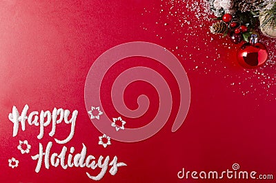 Happy Holidays in snow on red festive background Stock Photo