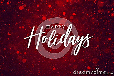 Happy Holidays Text Over Festive Red Sparkle Glitter Background. Magical Christmas Calligraphy Font with Glowing Bokeh Lights. Stock Photo