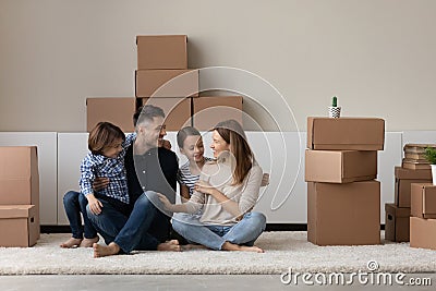 Happy homeowners celebrating moving into own apartment. Stock Photo