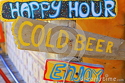 Happy hour colorful sign board with cold beer and having fun Stock Photo