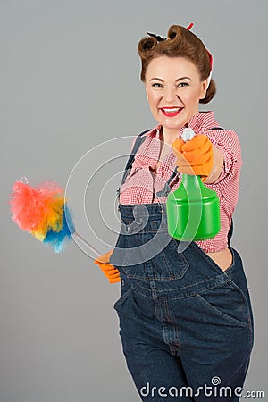 Happy housewife ready to spray and clean Stock Photo