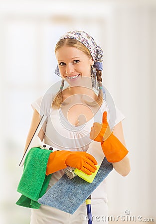 Happy housewife shows a thumb up Stock Photo