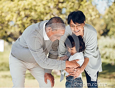 Happy, hug and grandparents with child in park for playing, love and support. Care, smile and freedom with family and Stock Photo