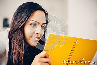 Happy Indian woman student education writing study Stock Photo