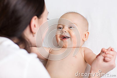 Happy infant baby looking at mom Stock Photo