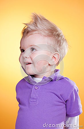 Happy interested little boy in violet Stock Photo