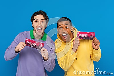 happy interracial friends concert tickets in Stock Photo