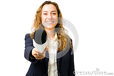 Hispanic woman smiling while doing a news interview Stock Photo