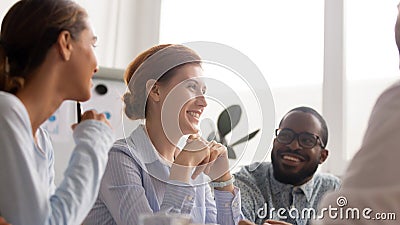 Happy joyful diverse business people talking laughing at funny joke Stock Photo