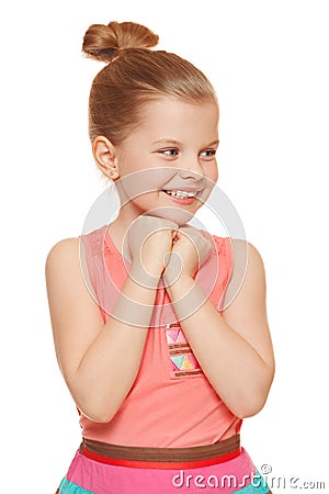 Happy joyful little girl looking sideways in excitement, isolated on white background Stock Photo