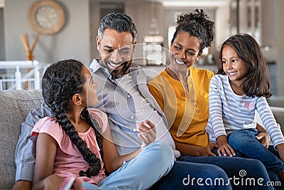 Happy joyful mixed race family having fun together Stock Photo