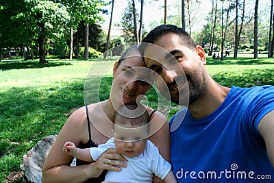 Happy joyful young family father, mother and little baby girl ha Stock Photo