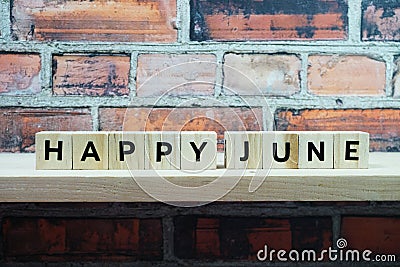 Happy June alphabet letter on shelves wooden background Stock Photo