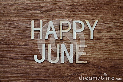 Happy June text message on wooden background Stock Photo