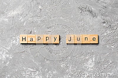 Happy June word written on wood block. Happy June text on table, concept Stock Photo