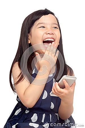 Happy kid playing on smartphone Stock Photo