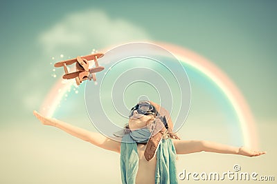 Happy kid playing with toy airplane Stock Photo