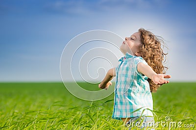 Happy kid with raised arms Stock Photo