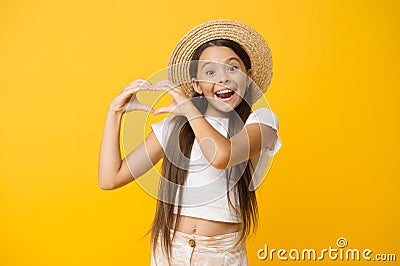 Happy kid show heart gesture. she love summer vacation. spring fashion for kids. childhood happiness. cheerful little Stock Photo