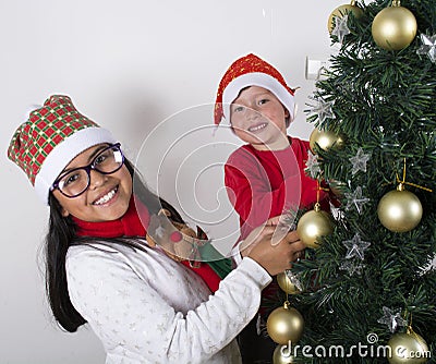 Happy kids laying under the christmas tree. Stock Photo