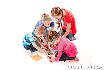 Happy kids playing with building blocks isolated on white Stock Photo