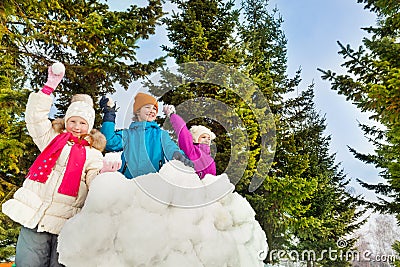 Happy kids playing snowballs game together Stock Photo