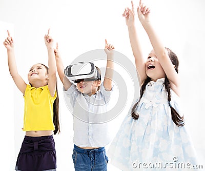 Happy kids using virtual reality headset Stock Photo