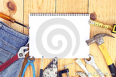 Happy Labour day. USA Labor day concept. International father`s day - Top view many handy tools and open notebook on wooden Stock Photo