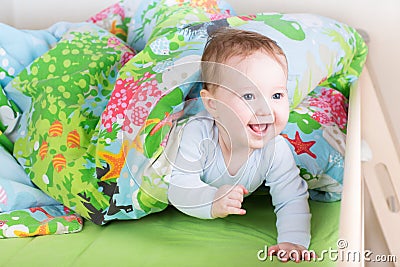 Happy laughing baby playing peek-a-boo Stock Photo