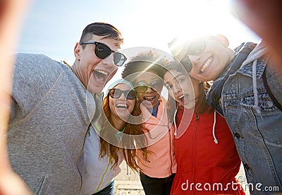 Happy laughing friends taking selfie Stock Photo