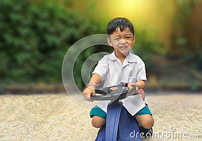 Happy little boy drive toy car.Playful kid at playground Stock Photo