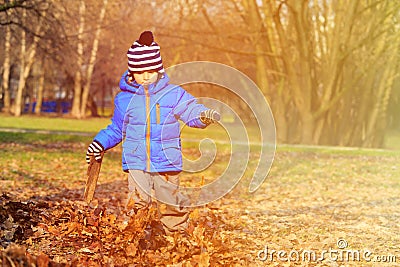 Happy little boy fun in autumn fall leaves Stock Photo