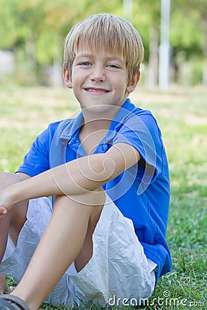 Happy little boy in the green park Stock Photo