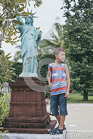 Happy little boy playing mini golf playing mini golf Editorial Stock Photo