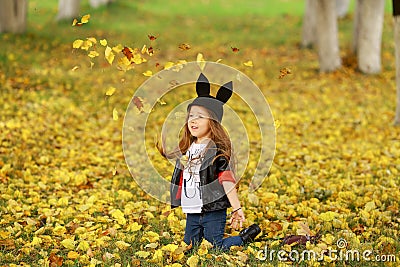 Happy little child, baby girl laughing and playing in the autumn on the nature walk outdoors. Stock Photo