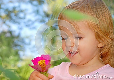 Happy little child, baby girl laughing and playing in Summer Stock Photo