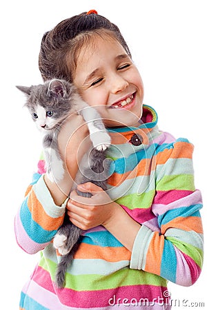 Happy little girl cuddle kitten Stock Photo
