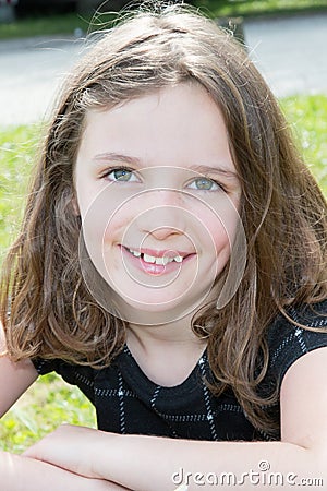 happy little girl enjoying park garden in spring Stock Photo