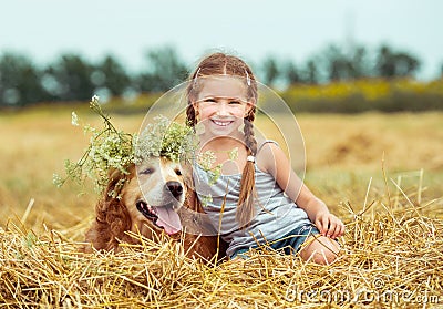 Happy little girl with her dog Stock Photo