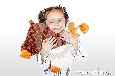 Happy little girl with her sheep toy - celebrating Eid ul Adha - Stock Photo