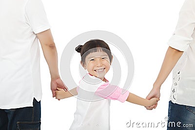 Happy little girl hold parents hands and smiling . Stock Photo