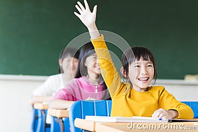 Happy little girl learning in the classroom Stock Photo