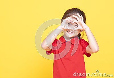 little girl making heart shape by hand Stock Photo