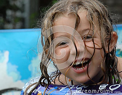 Happy little girl in pool Stock Photo