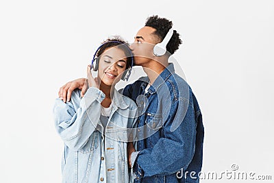 Happy lovely african couple in denim shirts posing together Stock Photo